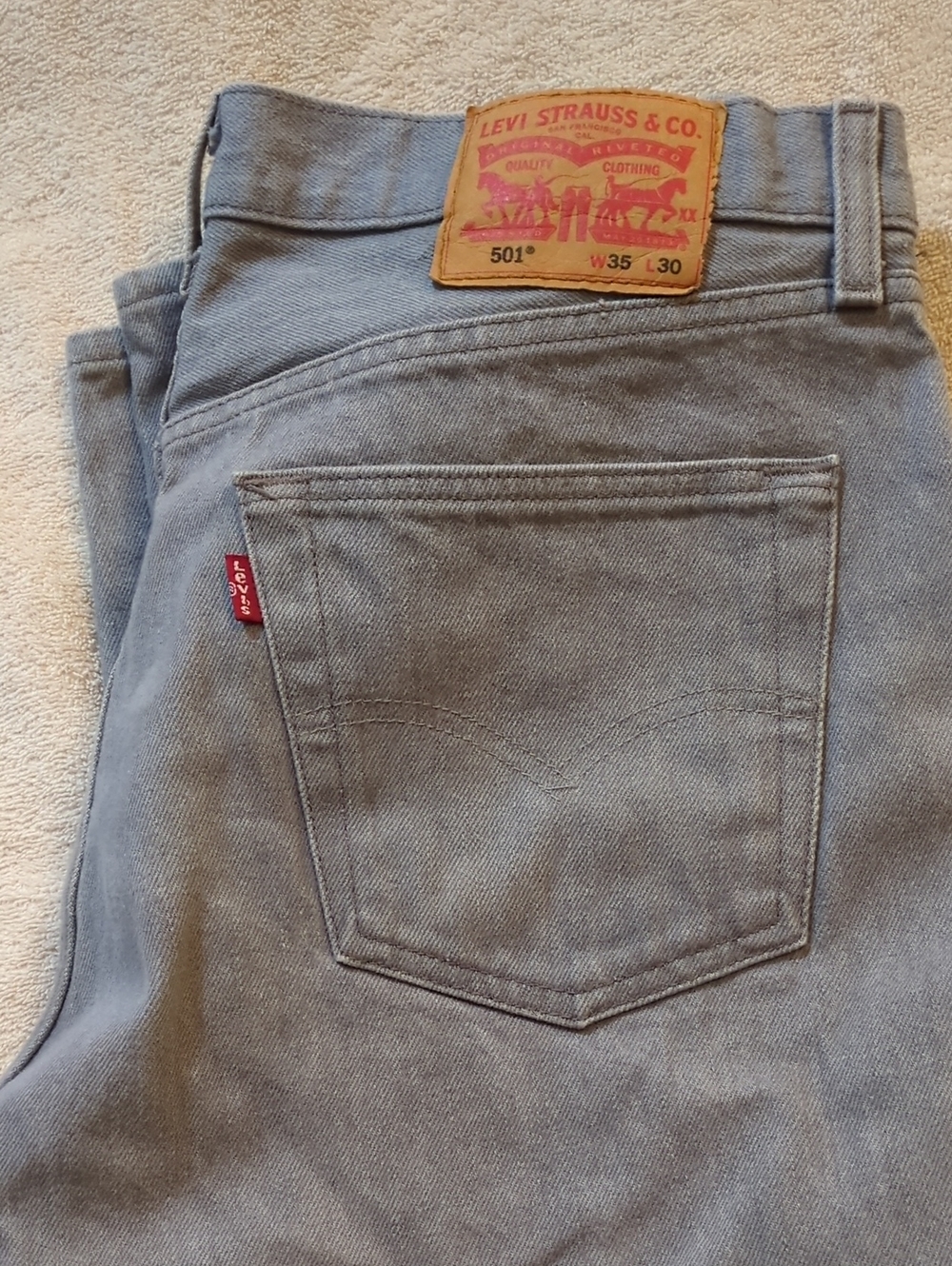 Levi's Faded Light Blue Denim Jeans With Button Front